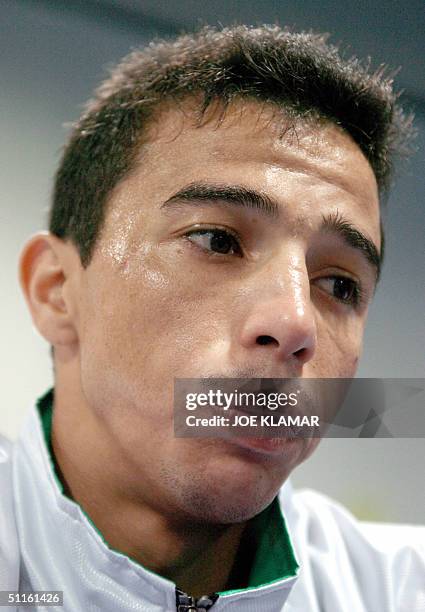 Iraqi Olympic boxer Ali Najah, representing lraq in the 48kg classification, is pictured during a practice session with his coach Termite Watkins at...