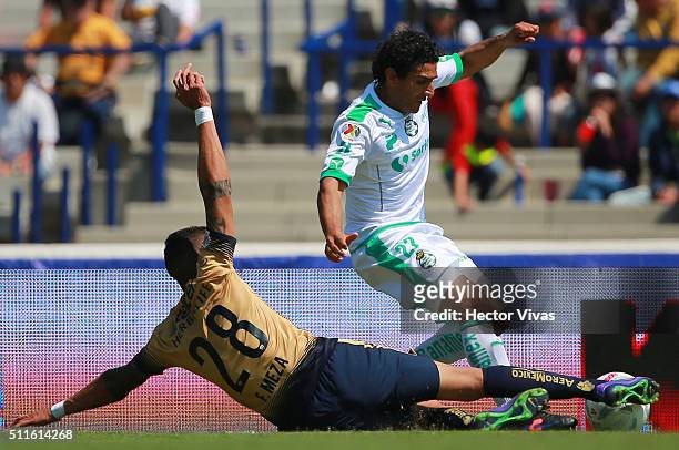 Francisco Meza of Pumas struggles for the ball with Martin Bravo of Santos Laguna during the 7th round match between Pumas UNAM and Santos Laguna as...