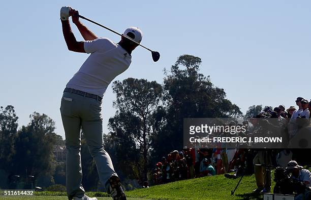 Dustin Johnson of the United States tees off at the 10th hole on the final day at the 2016 Northern Trust Open on February 21, 2016 at the Riviera...