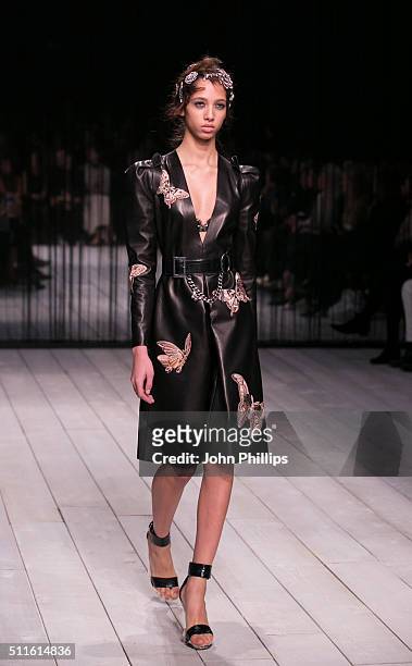 Model walks the runway at the Alexander McQueen show during London Fashion Week Autumn/Winter 2016/17 at Royal Horticultural Society on February 21,...