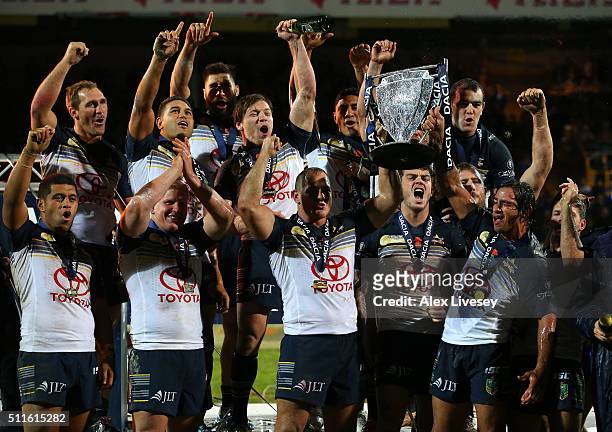 Johnathan Thurston and Matthew Scott of North Queensland Cowboys lift the World Club Series trophy after victory over Leeds Rhinos in the World Club...