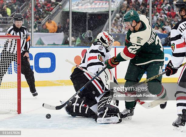 Nino Niederreiter of the Minnesota Wild misses a first period attempt against Corey Crawford of the Chicago Blackhawks at the TCF Bank Stadium during...