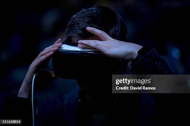 Visitor adjusts his a Samsung Gear VR device during the presentation of the new Samsung Galaxy S7 and Samsung Galaxy S7 edge on February 21, 2016 in...