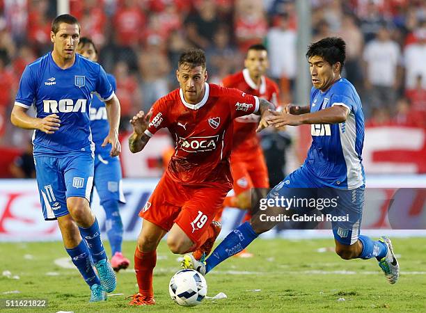 German Denis of Independiente fights for the ball with Luciano Lollo of Racing Club during the 4th round match between Independiente and Racing Club...