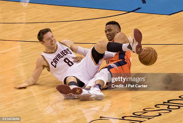 Russell Westbrook of the Oklahoma City Thunder steals the ball from Matthew Dellavedova of the Cleveland Cavaliers during the fourth quarter of a NBA...