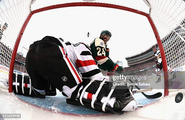 Matt Dumba of the Minnesota Wild scores against goaltender Corey Crawford of the Chicago Blackhawks in the first period of the 2016 Coors Light...