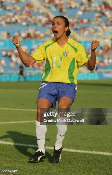 Marta of Brazil celebrates scoring the only goal in the women's football preliminary match between Brazil and Australia on August 11, 2004 during the...