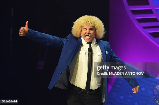 Former Colombian football player Carlos Valderrama arrives on stage during the draw for the Copa America Centenario 2016 championship at the...