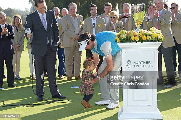 Bubba Watson's daughter Dakota runs to her dad during the trophy ceremony after Watson wins the Northern Trust Open at Riviera Country Club on...