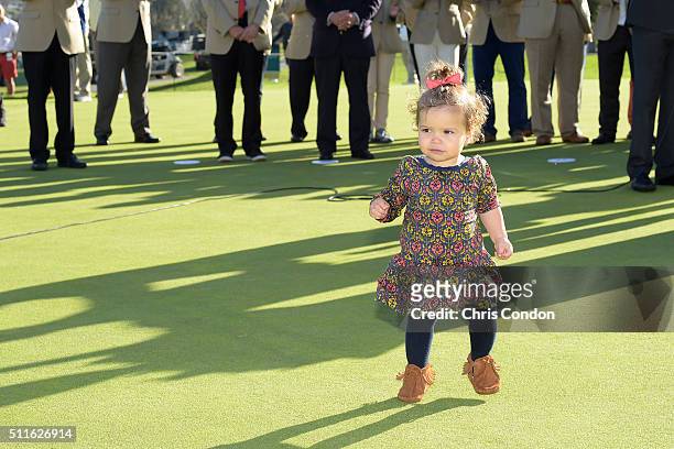 Bubba Watson's daughter Dakota runs on to the 18th green during the trophy ceremony after Watson wins the Northern Trust Open at Riviera Country Club...