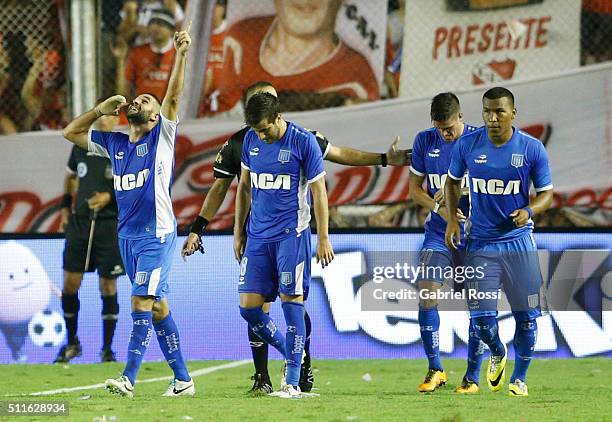 Lisandro Lopez of Racing Club celebrates with his teammates after scoring the tying goal during the 4th round match between Independiente and Racing...