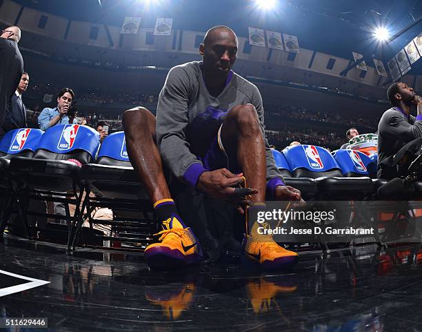 Kobe Bryant of the Los Angeles Lakers laces up his sneakers prior to the game against the Chicago Bulls on February 21, 2016 at the United Center in...