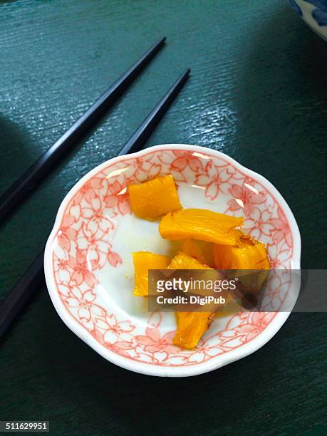 takuan flavored with katsuoboshi served in saucer - takuan stock pictures, royalty-free photos & images