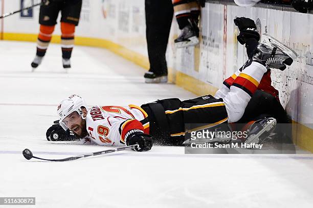 Deryk Engelland of the Calgary Flames lunges for a loose puck during the second period of a game agains the Anaheim Ducks at Honda Center on February...