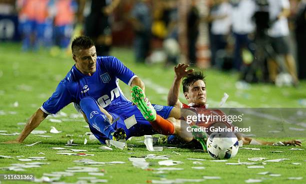 Ivan Pillud of Racing Club fights for the ball with Nicolas Tagliafico of Independiente during the 4th round match between Independiente and Racing...