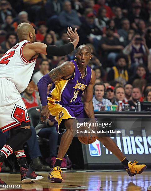 Kobe Bryant of the Los Angeles Lakers moves against Taj Gibson of the Chicago Bulls at the United Center on February 21, 2016 in Chicago, Illinois....