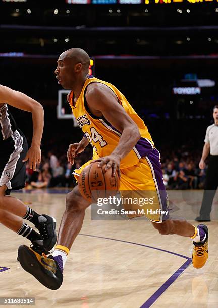 Kobe Bryant of the Los Angeles Lakers dribbles the ball during the second half of a game against the San Antonio Spurs at Staples Center on February...