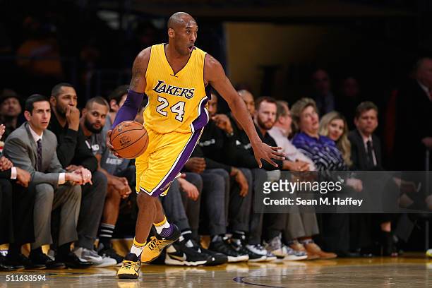 Kobe Bryant of the Los Angeles Lakers dribbles the ball during the second half of a game against the San Antonio Spurs at Staples Center on February...