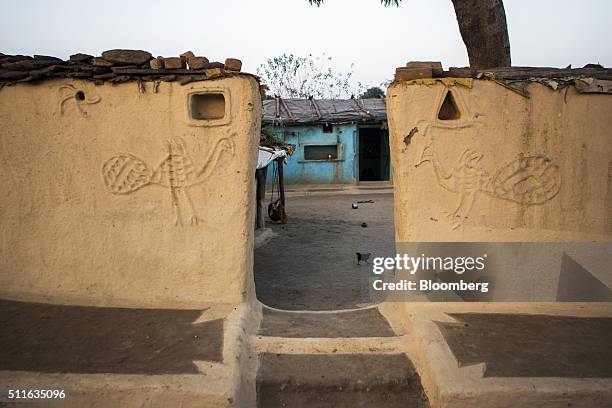 Residential building stands behind a courtyard wall in the village of Sakara in Lalitpur district, Madhya Pradesh, India, on Saturday, Feb. 9, 2016....