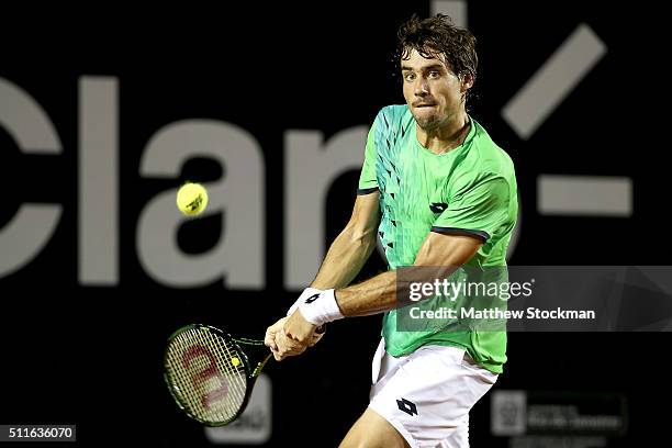 Guido Pella of Argentina returns a shot against Pablo Cuevas of Uraguay during the final of the Rio Open at Jockey Club Brasileiro on February 21,...