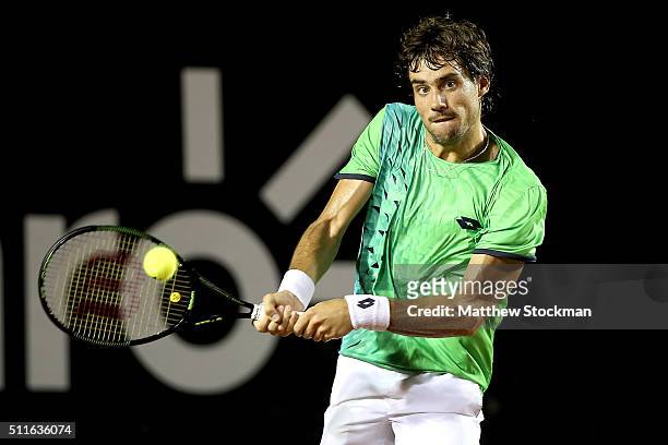 Guido Pella of Argentina returns a shot against Pablo Cuevas of Uraguay during the final of the Rio Open at Jockey Club Brasileiro on February 21,...