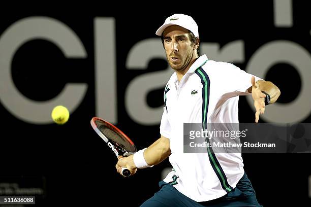 Pablo Cuevas of Uraguay returns a shot against Guido Pella of Argentina during the final of the Rio Open at Jockey Club Brasileiro on February 21,...