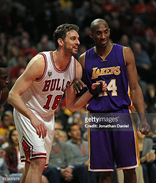 Pau Gasol of the Chicago Bulls and Kobe Bryant of the Los Angeles Lakers smile and chat as they await a free-throw at the United Center on February...