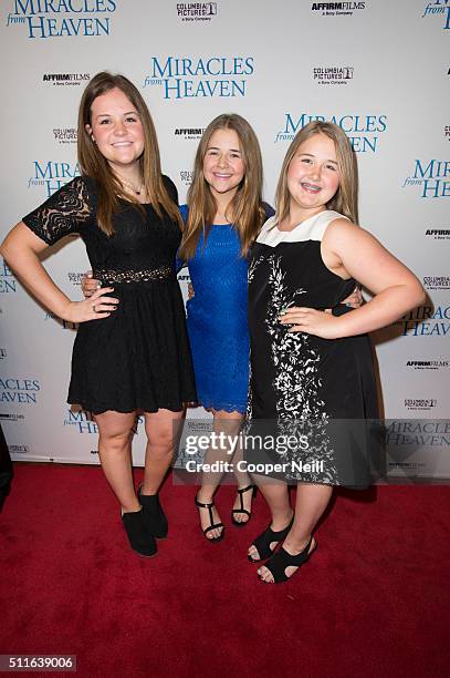 Abbie Beam, Annabel Beam and Adelynn Beam pose for a photo on the red carpet for the premiere of "Miracles From Heaven" on February 21, 2016 in...