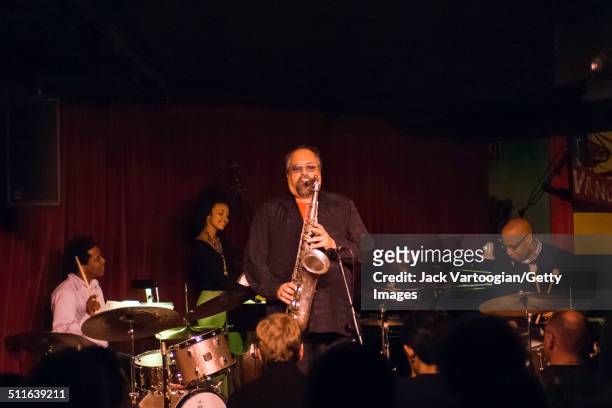 American Jazz musician Joe Lovano plays tenor saxophone as he leads his 'Us Five' quintet at the Village Vanguard, New York, New York, November 14,...
