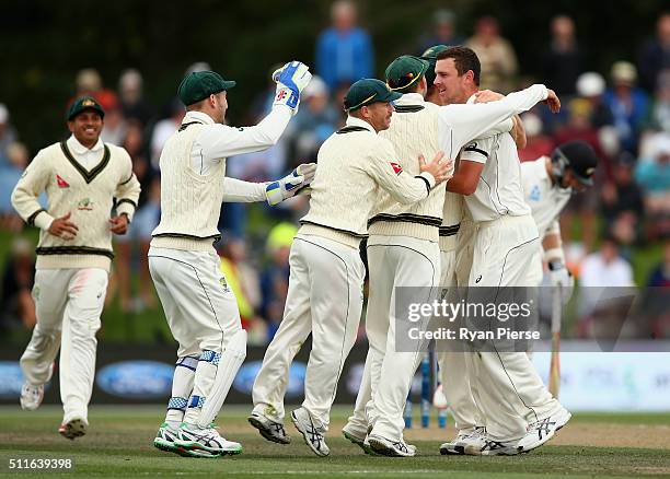 Josh Hazlewood of Australia celebrates after taking the wicket of Brendon McCullum of New Zealand during day three of the Test match between New...