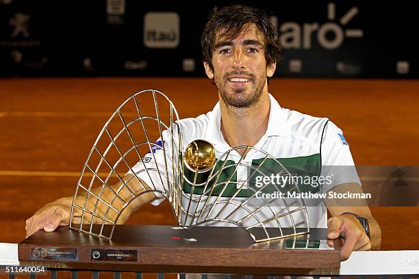 Pablo Cuevas of Uraguay poses for photographers after defeating Guido Pella of Argentina during the final of the Rio Open at Jockey Club Brasileiro...