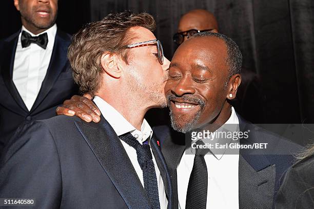 Actor Robert Downey Jr. Kisses honoree Don Cheadle during the 2016 ABFF Awards: A Celebration Of Hollywood at The Beverly Hilton Hotel on February...