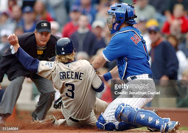 Michael Barrett of the Chicago Cubs tags out Khalil Greene of the San Diego Padres in the third inning on August 12, 2004 at Wrigley Field in...