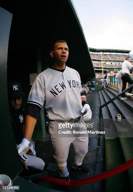 Alex Rodriguez of the New York Yankees watches from the dugout during play against the Texas Rangers on August 12, 2004 at Ameriquest Field in...