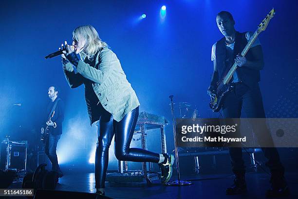 James Shaw, Emily Haines and Joshua Winstead of Metric perform on stage at The Moore Theater on February 21, 2016 in Seattle, Washington.
