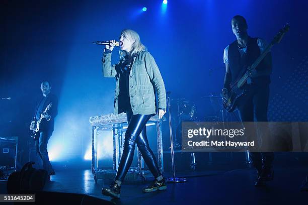 James Shaw, Emily Haines and Joshua Winstead of Metric perform on stage at The Moore Theater on February 21, 2016 in Seattle, Washington.