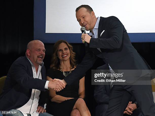 Rick Harrison from History's "Pawn Stars" television series shakes hands with singer/actor Donnie Wahlberg as Julie Chaffetz , wife of U.S. Rep....