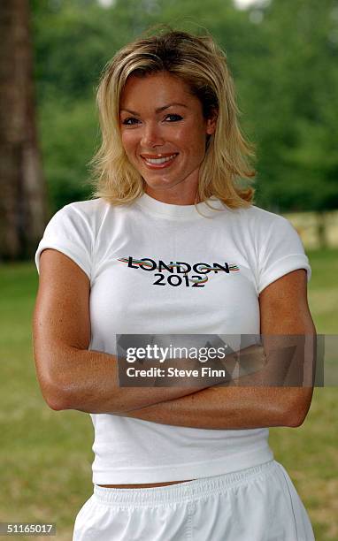 Model and London 2012 bid ambassador Nell McAndrew raises the first of hundreds of London 2012 "Back the Bid" flags at The Mall on August 13, 2004 in...