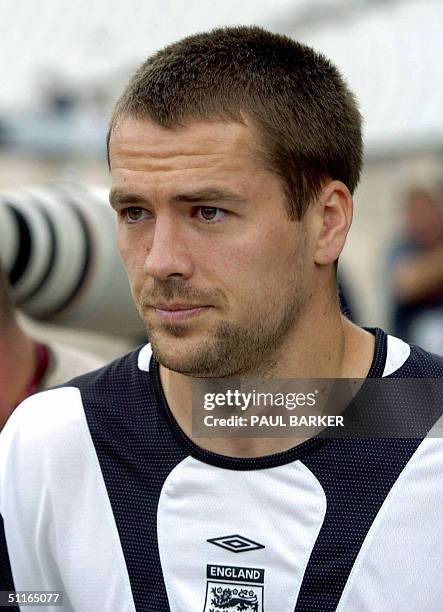 This file photo shows England's forward Michael Owen arriving 19 June 2004 for a team training session at Lisbon's Estadio Nacional during the...
