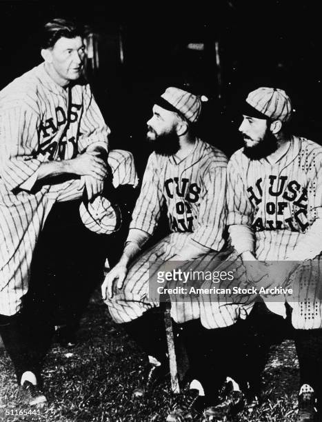 Pete Alexander (also known as Grover Cleveland Alexander , the playing manager of the House of David baseball team , takes with two of his players,...