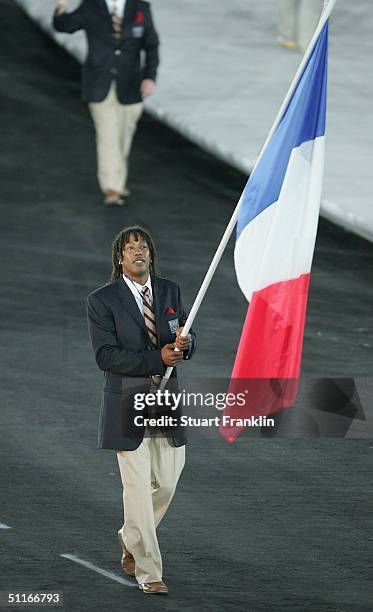 Flag bearer Jackson Richardson leads the delegation from France as he walks during the parade of nations, part of the opening ceremonies for the...