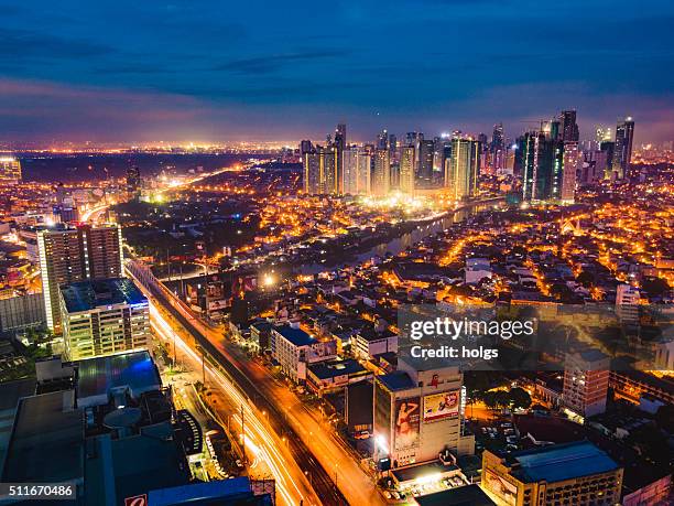 mandaluyong city and pasig river at night - mandaluyong stock pictures, royalty-free photos & images