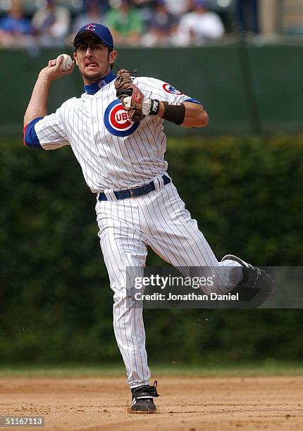 Nomar Garciaparra of the Chicago Cubs throws out Shawn Green of the Los Angeles Dodgers in the second inning on August 13, 2004 at Wrigley Field in...