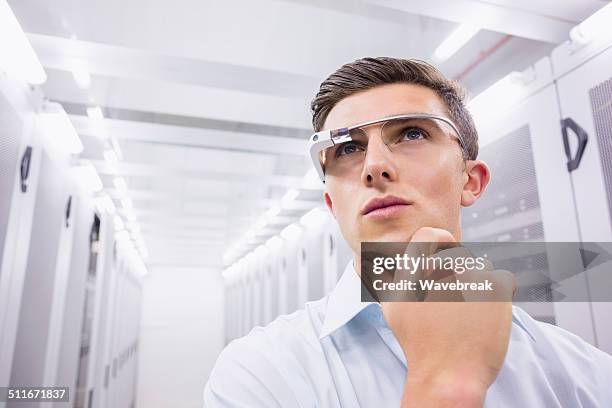 businessman standing in the server room - configuring stock pictures, royalty-free photos & images