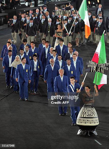 Members of the Iranian Olympic squad parade, led by flag bearer judoka Arash Miresmaeili , entry into the Olympic stadium in Athens, 13 August 2004,...