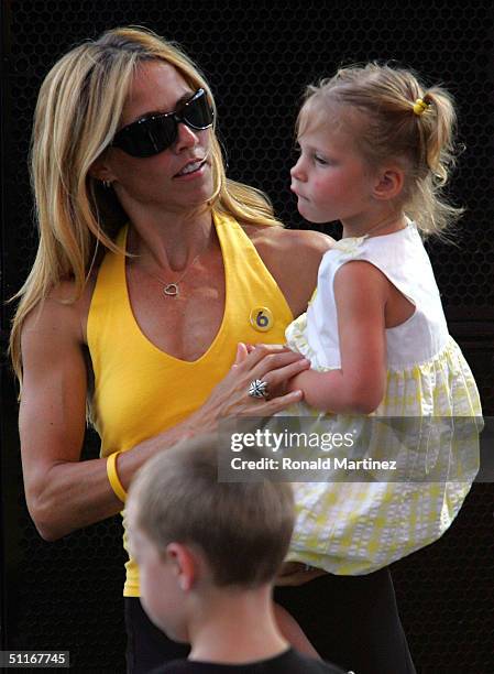 Musician Sheryl Crow holds Lance Armstrong's daughter, Grace during a celebration in Armstrong's honor on August 13, 2004 in Austin, Texas. Armstrong...