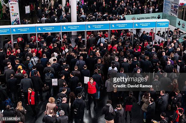 Visitors arrive to the Mobile World Congress 2015 on the opening day of the event at the Fira Gran Via Complex on February 22, 2016 in Barcelona,...