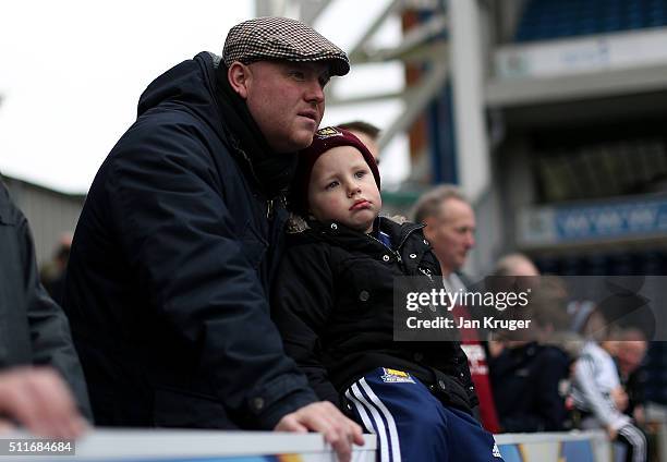 Young fan looks on from the stands prior to the Emirates FA Cup fifth round match between Blackburn Rovers and West Ham United at Ewood Park on...