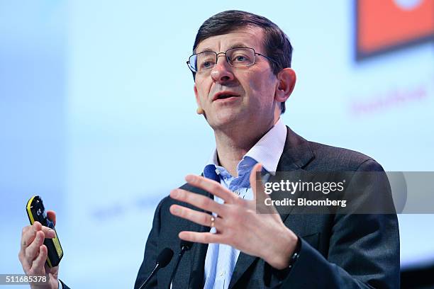 Vittorio Colao, chief executive officer of Vodafone Group PLC, gestures as he speaks during a keynote address at the Mobile World Congress in...