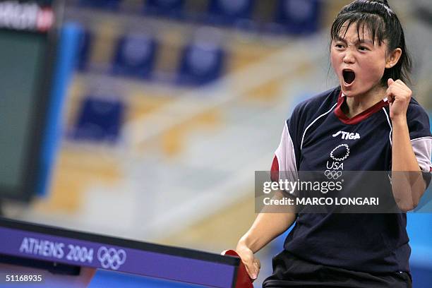 Tawny Banh of the US reacts after winning her match against South Korean Yoon Ji-Hye in their women's singles first round match at the Olympic Games...